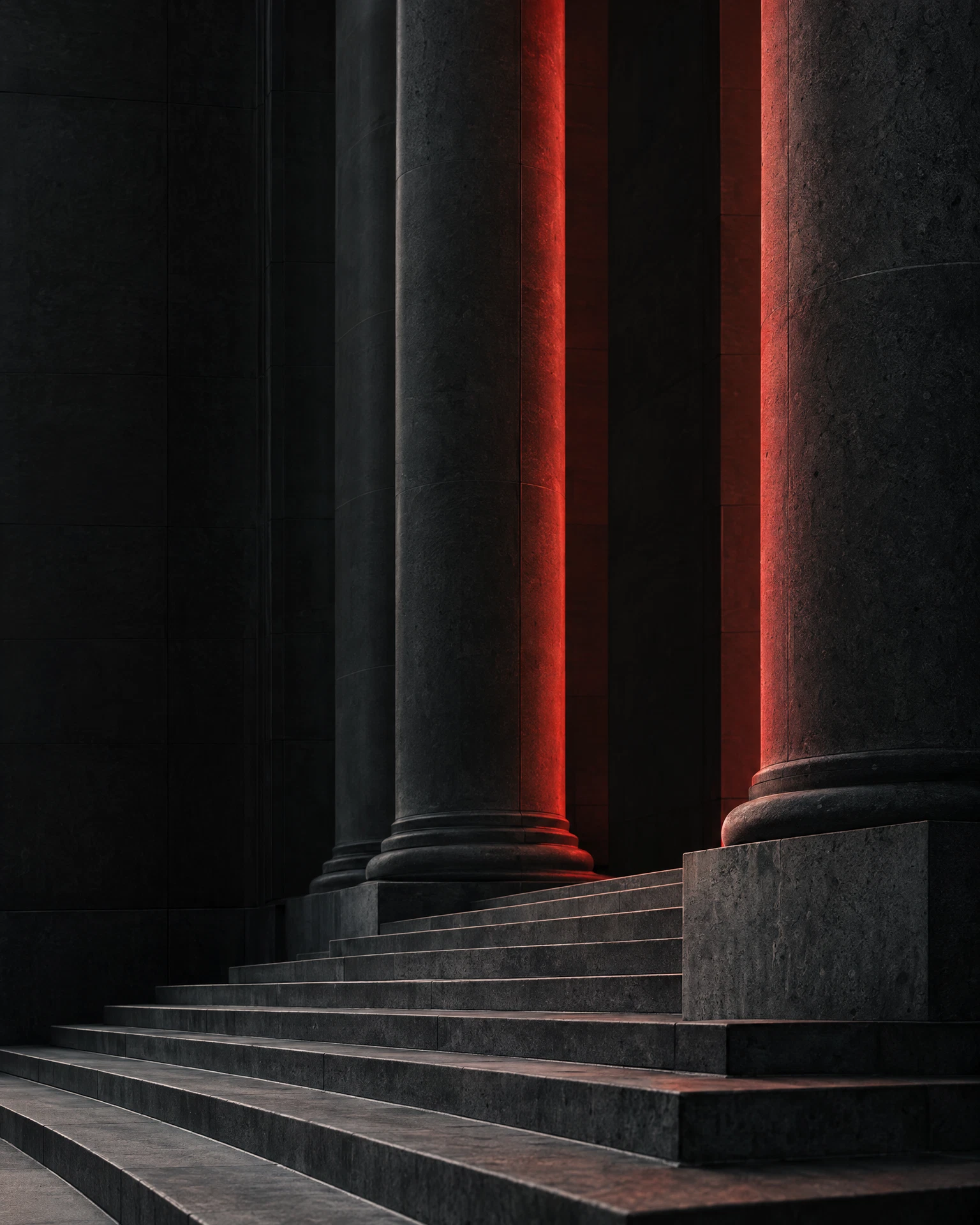 Abstract dark stone architecture with a restrained crimson accent